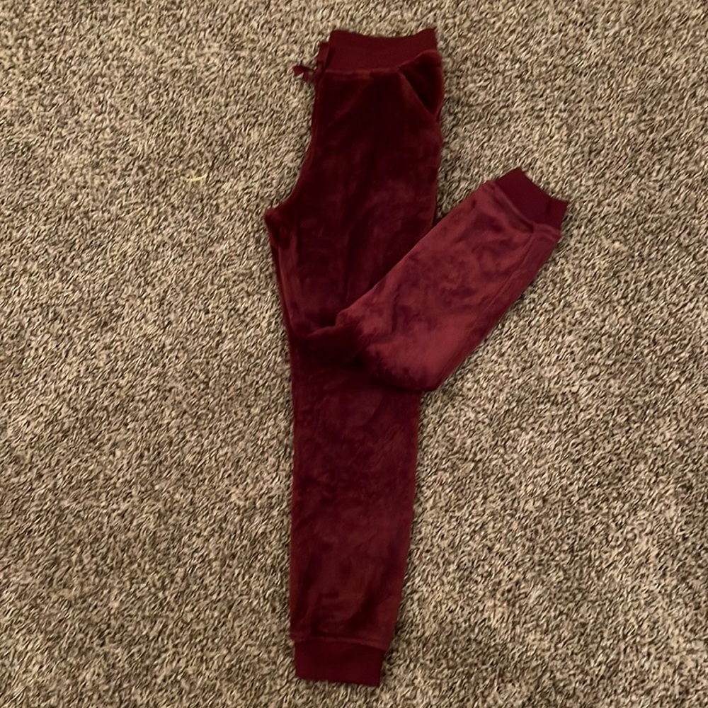 Maroon fuzzy joggers with gold glitter